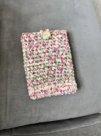 The Confetti pouch, holding a tablet, side view