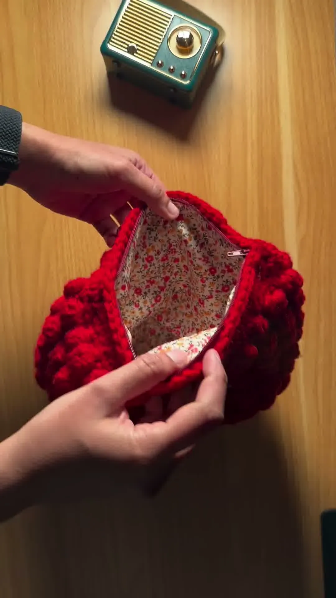 The Ruby pouch open, showing the floral lining