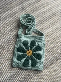 The Meadow crossbody, strap folded