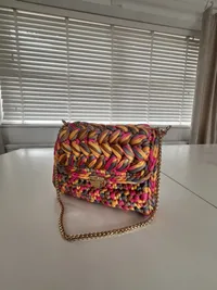 The Riviera bag, worn on the shoulder